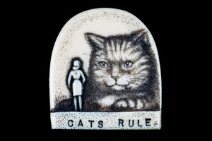 With our unique backing, you can wear this stunning piece either as a pin or pendant with the included 18" Silver Plated Chain.  This distinct originally hand etched Cats Rule designed pin/pendant.  The backing of this piece has the findings to be a pin, as well as a pendant.  They come with an 18" Silver Plated Chain.  This is part of the incredible line of Mossup Valley Designs that we carry, with the wonderful artist Rachel Badeau.  The dimensions of the necklace are 1.17" x 1.28" x 0.37".  The SKU is MVD PN 41.

Rachel Badeau has been etching and engraving in a variety of media for over thirty years.  Her work, characterized by fine line and intricate detail, attempts to touch the hearts and emotions of others.  All while reflecting her love of animals, nature and the human spirit.