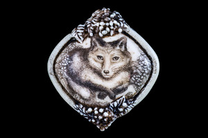 MVD PN 46 Fox and the Grapes Zoom.  This distinct originally hand etched Fox and the Grapes designed pin/pendant.  The backing of this piece has the findings to be a pin, as well as a pendant.  They come with an 18" Silver Plated Chain.  This is part of the incredible line of Mossup Valley Designs that we carry, with the wonderful artist Rachel Badeau.  The dimensions of the necklace are 1.50" x 1.66" x 0.37".  The SKU is MVD PN 46.

Rachel Badeau has been etching and engraving in a variety of media for over thirty years.  Her work, characterized by fine line and intricate detail, attempts to touch the hearts and emotions of others.  All while reflecting her love of animals, nature and the human spirit.  

The resin scrimshaw piece is originally hand etched by Rachel Badeau.  We make a mold of the original piece and do an open cast pour of our resin mixture.  The pieces are removed from the mold and sanded and inked.