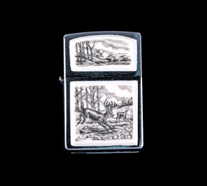 This is a stunning originally hand etched Eco-Ivory Scrimshaw Jumping Deer Designed Zippo! The top of the flip lighter has a a Mountain Range with Tree's design.  The Zippo is a Brushed Chrome finish. Each lighter has a bottom stamp signifying the year it was made, is refillable. All windproof lighters are American made in Bradford, PA factory and come packaged in a gift box.  This is part of the Save the Elephant Collection and was originally hand etched by Linda Layden.  The SKU is NC 54 - 110.

The Zippo Lighter is 2.24" x 1.51" x 0.59".  It weighs 2.04 oz.