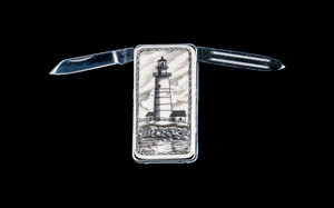 Scrimshaw Boston Lighthouse Money Clip Knife blades open.  This beautiful originally hand etched Boston Lighthouse design on a Large Rectangle Knife Money Clip.  This unique money clip has a small knife blade and a nail filer.  This is a useful money clip that duals as a practical knife.

The artwork was originally hand etched by Linda Layden.  The dimensions of the Large Rectangle Knife Money Clip with the blade(s) closed are 2.08" x 1.32" x 0.30".  The knife blade itself is approximately 1.45" and the nail file is approximately 1.50", making the width of the money clip with both open 5.03".  The SKU is NC 20 - 803.

Linda Layden has been making beautiful works of art in the scrimshaw field for over 40 years.  Originally a hobby that became a full time job.  Her work can be found in gift shops, galleries and museums across the world.  

The resin scrimshaw piece is originally hand etched by Linda Layden.  We make a mold of the original piece and do an open cast pour of our resin mixture.  The pieces are removed from the mold and sanded and inked.

We believe that serving nature is one of the commissions that we as humans have been given here on earth.  We wish to lend our resources to those charged with protecting elephants from poaching for their ivory. 

On a monthly basis we donate to organizations whose purpose to protect the elephants and other species throughout the planet.  We focus our donations on organizations that put the money to good use and have a low overhead. With the majority of incoming funds going back to saving the elephants!

Features
Hand Etched Acrylic Resin Scrimshaw 
Originally Hand Etched in the USA! 
NC 20 Large Rectangle Money Clip Knife
Stainless Steel 
Small Knife Blade
Small Nail Filer
Nautical Design
Boston Lighthouse
Save the Elephant Collection