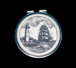 Ship and Light Money Clip.This stunning originally hand etched Scrimshaw Ship and Lighthouse design on a Rond Spring Money Clip.  This unique piece is a spring money clip.  The back of the money clip has a stainless steel spring that will hold your money secure.  Regardless if it is a small or large stack of bills.  

The artwork was originally hand etched by Linda Layden.  The artistic insert is an 1.5", the size of a silver dollar.  The dimensions of the Large Rectangle Money Clip is 1.68" x 1.81" x 0.46".  The SKU is NC 24 - 406.