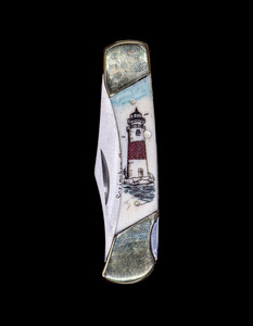 This sharp hand etched Colored Lighthouse design on a 440 Stainless Steel Blade LB 3 Knife. The depicted lighthouse is Sankaty Head Light on Nantucket, MA.  This beautiful knife is part of the Scrimshaw Collection, with those words laser engraved into the blade.  The LB 3 knifes come with the pictured leather sheath and each scale is made with Bovine Bone.  The LB 3 Knife has bolsters and shackle that are nickel silver with brass pins and liner.  It is a lock blade knife and a very useful pocket knife. The dimensions of the LB 3 Pocket Knife with the blade closed are 2.97" x 0.76" x 0.31".  The blade itself is approximately 2.21" making the width of the knife with an open blade 5.18".  The SKU is LB-3 436.