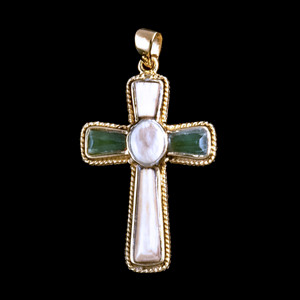 Large Cross Alaskan Mammoth Jade 14K Gold Pendant

This striking large cross shaped Alaskan Mammoth Jade piece is inlayed into a 14K Gold pendant.  This pendant comes with an 18" 14K Gold chain.  The dimensions of the Alaskan Mammoth Jade pendant is approximately 1.23" x .79".  The product id # is PMJ-1079-G

It is a 14K plate on sterling silver. The plating is with 30mils of 14k gold. Typically plating is done with 3mils of gold. We work with the extra gold plating to ensure your beautiful jewelry piece will have a strong gold color for years to come!!  

The pre-historic Mammoth tusks are found as a bi - product of the gold mining industry in Alaska. They are carbon dated to be approximately 25,800 years old.  The color of your mammoth tusk may vary due to the minerals in the ground water where the tusks are buried.  The varying color of the mammoth tusks make each piece of jewelry unique. Cracks and splits in the ivory occur naturally due to it’s great age.  Our materials are considered eco-friendly because no animals were harmed in the making of this beautiful piece of jewelry. 

Genuine Jade (nephrite) is a fascinating gemstone and the state gem of Alaska. In prehistoric times, prized for its toughness, jade was used to make weapons, tools and later simple ornaments. Jade purportedly can protect you from evil, attract love and of course bring you good luck. It is now regarded as a symbol of energy and beauty. Stimulating creativity and mental agility along with harmony and balance. The jade we use comes from the Nana Region of Alaska.