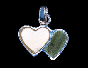 Small Double Heart Alaskan Mammoth Jade Sterling Silver Pendant Zoom

This elegant small double heart shaped Alaskan Mammoth and Jade is inlayed into a Sterling Silver pendant.  This pendant comes with an 18" Sterling Silver chain.  The dimensions of the Alaskan Mammoth Jade pendant is approximately .41" x .63".  The product # is PMJ-1062-S

It is a 14K plate on sterling silver. The plating is with 30mils of 14k gold. Typically plating is done with 3mils of gold. We work with the extra gold plating to ensure your beautiful jewelry piece will have a strong gold color for years to come!!  

The pre-historic Mammoth tusks are found as a bi - product of the gold mining industry in Alaska. They are carbon dated to be approximately 25,800 years old.  The color of your mammoth tusk may vary due to the minerals in the ground water where the tusks are buried.  The varying color of the mammoth tusks make each piece of jewelry unique. Cracks and splits in the ivory occur naturally due to it’s great age.  Our materials are considered eco-friendly because no animals were harmed in the making of this beautiful piece of jewelry. 

Genuine Jade (nephrite) is a fascinating gemstone and the state gem of Alaska. In prehistoric times, prized for its toughness, jade was used to make weapons, tools and later simple ornaments. Jade purportedly can protect you from evil, attract love and of course bring you good luck. It is now regarded as a symbol of energy and beauty. Stimulating creativity and mental agility along with harmony and balance. The jade we use comes from the Nana Region of Alaska.