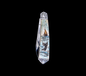 Ship and Whale Vertical Colored DB 2222.  This beautiful hand etched Vertical Colored Ship and Whale scene on a 440 Stainless Steel Dual Blade Knife.  The knife design is similar to the Shrade 2222 knife.  This beautiful knife is part of the Scrimshaw Collection, with those words laser engraved into the blade.  The DB 2222 knifes come with the pictured leather sheath and each scale is made with Bovine Bone.  The DB 2222 knife has bolsters that are nickel silver with brass pins and liner.  It is a dual blade knife and a very useful pocket knife.  The dimensions of the DB 2222 Pocket Knife with the blade closed are 3.48" x 0.90" x 0.58".  The large blade itself is approximately 2.67" making the width of the knife with an open blades 6.15".  The small blades length is approximately 1.90".  The SKU is DB 2222 - 403CV.

The scrimshaw is inked with colored india ink and sealed with renaissance wax, which is used by museums for antique restoration.  It also helps bring out the beauty of the artwork as well as in the cow bone. The knife is water resistant, but not waterproof.