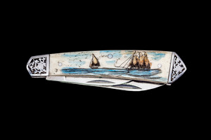 DB 2222 401 DC Dual Blade Knife.  This unique hand etched Vertical Double Tall Ship Nautical Scene on a 440 Stainless Steel Dual Blade Knife.  The knife design is similar to the Shrade 2222 knife.  This beautiful knife is part of the Scrimshaw Collection, with those words laser engraved into the blade.  The DB 2222 knifes come with the pictured leather sheath and each scale is made with Bovine Bone.  The DB 2222 knife has bolsters that are nickel silver with brass pins and liner.  It is a dual blade knife and a very useful pocket knife.  The dimensions of the DB 2222 Pocket Knife with the blade closed are 3.48" x 0.90" x 0.58".  The large blade itself is approximately 2.67" making the width of the knife with an open blades 6.15".  The small blades length is approximately 1.90".  The SKU is DB 2222 - 401DC.

The scrimshaw is inked with colored india ink and sealed with renaissance wax, which is used by museums for antique restoration.  It also helps bring out the beauty of the artwork as well as in the cow bone. The knife is water resistant, but not waterproof.