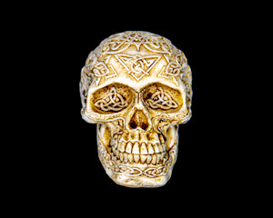 NC 109 - 01 Carved Skull Paperweight/Decoration Front. This is an incredible originally hand card Skull Paperweight/Decorative Piece.  The piece has Celtic/Nordic designs on the piece.  The SKU is NC 109 - 01.  The Skull weighs 7.7 ounces, and the measurements are 3.49" x 2.63" x 2.4"

The original piece was originally hand carved, and we make a mold of the original piece and do an open cast pour of our resin mixture.  The pieces are removed from the mold and sanded and stained.