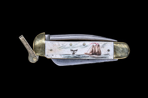 This stunning hand etched Ship and Whale Colored Design on a 440 Stainless Steel Blade Marlin Spike with a foldable bladed knife.  The Marlin Spike has a lock feature, while the knife blade is foldable.

This beautiful knife is part of the Scrimshaw Collection, with those words laser engraved into the blade.  The MS knifes come with the pictured leather sheath and each scale is made with Bovine Bone.  The MS Knife has bolsters and shackle that are nickel silver with brass pins and liner.  It is a lock blade Marlin Spike with a very useful pocket knife. The Marlin Spike is made of Stainless Steel.  The dimensions of the MS Knife with the blade closed are 4.11" x 2.17" x 0.69".  The blade itself is approximately 2.91" making the width of the knife with an open blade 7.02".  The Marlin Spike is 3.05" long.  The SKU is MS 403C.