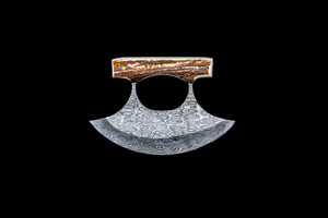 This beautiful Shed Antler handle on a Damascus Ulu Blade.  

An ulu is an all-purpose knife traditionally used by Inuit, Iñupiat, Yupik, and Aleut women. The knife can be used in a variety of diverse ways such as skinning and cleaning animals, cutting a child's hair, cutting food, and sometimes even trimming blocks of snow and ice used to build an igloo.

The weight of the knife is 8.99 ounces and the dimensions of the DM 005 Knife closed are 5.44" x 3.77" x 0.88".   The SKU is DM 005 001.  The knife comes with the pictured leather sheath.

  During the winter season, moose shed their antlers before regrowing them in the spring. The shedding process, also known as casting, is a normal event that occurs annually for many male cervids—a group of hoofed mammals like moose, deer and elk.

Damascus steel is a type of steel easily recognisable by its wavy patterned design. Aside from its sleek look and beautiful aesthetics, Damascus steel is highly valued as it is hard and flexible while maintaining a sharp edge. Weapons forged from Damascus steel were far superior to those formed from just iron.  It a combination of carbon steel and regular steel that is folded 71 times.  

Features:
Shed Antler Handle
Ulu
Damascus Blade
Carbon and regular Steel
Folded 71 time