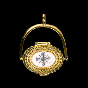 This is an beautifully detailed 22K Plated Gold Nantucket Basket Pendant with a replica scrimshaw Compass Rose design top.  Inside the basket is a mini penny.  The basket on it's own has the following dimensions, .78"x .48"x .77".  The pendant holder add .22" x .85".  Each pendant weighs .31 ounces.  All the pendants come with an 18" gold chain. The item number is GNB 149.

This Nantucket Lightship basket pendant is made in pewter and was plated in 22k Gold.  These beautiful baskets are similar to what is seen on the Netflix hit, Sirens

Nantucket lightship baskets, characterized by their rattan staves, cane weavers, and wooden bases, originated on the island's lightships in the mid-1800s. Initially, these baskets were a way for lightship crewmen to pass the time during long deployments and were primarily utilitarian. Over time, the baskets evolved, becoming more refined and sought after as souvenirs of Nantucket.

Keeping with the tradition of a penny in the basket.  A penny is placed inside the basket to symbolize good luck.  Each of our basket pendants have a mini penny inside to carry on the tradition.  

Linda Layden has been making beautiful works of art in the scrimshaw field for over 40 years.  Originally a hobby that became a full time job.  Her work can be found in gift shops, galleries and museums across the world.  

The resin scrimshaw piece is originally hand etched by Linda Layden.  We make a mold of the original piece and do an open cast pour of our resin mixture.  The pieces are removed from the mold and sanded and inked with Indian Ink.

We believe that serving nature is one of the commissions that we as humans have been given here on earth.  We wish to lend our resources to those charged with protecting elephants from poaching.

On a monthly basis we donate to organizations whose purpose to protect the elephants and other species throughout the planet.  We focus our donations on organizations that put the money to good use and have a low overhead. With the majority of incoming funds going back to saving the elephants!

American Made
Nantucket Basket Pendant
22k Gold Plated
Pewter Base 
Mini Penny
18" Gold Chain
Compass Rose Map
Resin Scrimshaw Design Top
Lifetime Guarantee