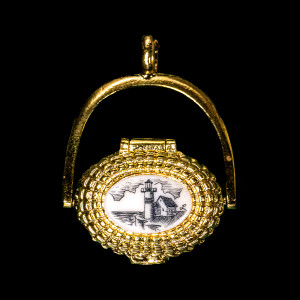 This is an beautifully detailed 22K Plated Gold Nantucket Basket Pendant with a replica scrimshaw with a Lighthouse design top.  Inside the basket is a mini penny.  The basket on it's own has the following dimensions, .78"x .48"x .77".  The pendant holder add .22" x .85".  Each pendant weighs .31 ounces.  All the pendants come with an 18" gold chain. The item number is GNB 817.

This Nantucket Lightship basket pendant is made in pewter and was plated in 22k Gold.  These beautiful baskets are similar to what is seen on the Netflix hit, Sirens

Nantucket lightship baskets, characterized by their rattan staves, cane weavers, and wooden bases, originated on the island's lightships in the mid-1800s. Initially, these baskets were a way for lightship crewmen to pass the time during long deployments and were primarily utilitarian. Over time, the baskets evolved, becoming more refined and sought after as souvenirs of Nantucket.

Keeping with the tradition of a penny in the basket.  A penny is placed inside the basket to symbolize good luck.  Each of our basket pendants have a mini penny inside to carry on the tradition.  

Linda Layden has been making beautiful works of art in the scrimshaw field for over 40 years.  Originally a hobby that became a full time job.  Her work can be found in gift shops, galleries and museums across the world.  

The resin scrimshaw piece is originally hand etched by Linda Layden.  We make a mold of the original piece and do an open cast pour of our resin mixture.  The pieces are removed from the mold and sanded and inked with Indian Ink.

We believe that serving nature is one of the commissions that we as humans have been given here on earth.  We wish to lend our resources to those charged with protecting elephants from poaching.

On a monthly basis we donate to organizations whose purpose to protect the elephants and other species throughout the planet.  We focus our donations on organizations that put the money to good use and have a low overhead. With the majority of incoming funds going back to saving the elephants!

American Made
Nantucket Basket Pendant
22k Gold Plated
Pewter Base 
Mini Penny
18" Gold Chain
Lighthouse Design
Resin Scrimshaw Design Top
Lifetime Guarantee