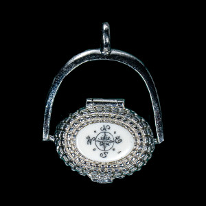 This is a beautifully detailed Sterling Silver Plated Nantucket Basket Pendant with a replica scrimshaw Compass Rose design.  Inside the basket is a mini penny.  The basket on it's own has the following dimensions, .78"x .48"x .77".  The pendant holder add .22" x .85".  Each pendant weighs .31 ounces.  All the pendants come with an 18" Sterling Silver chain. The item number is SNB 149.

This Nantucket Lightship basket pendant is made in pewter and was plated in Sterling Silver.  These beautiful baskets are similar to what is seen on the Netflix hit, Sirens

Nantucket lightship baskets, characterized by their rattan staves, cane weavers, and wooden bases, originated on the island's lightships in the mid-1800s. Initially, these baskets were a way for lightship crewmen to pass the time during long deployments and were primarily utilitarian. Over time, the baskets evolved, becoming more refined and sought after as souvenirs of Nantucket.

Keeping with the tradition of a penny in the basket.  A penny is placed inside the basket to symbolize good luck.  Each of our basket pendants have a mini penny inside to carry on the tradition.  

Linda Layden has been making beautiful works of art in the scrimshaw field for over 40 years.  Originally a hobby that became a full time job.  Her work can be found in gift shops, galleries and museums across the world.  

The resin scrimshaw piece is originally hand etched by Linda Layden.  We make a mold of the original piece and do an open cast pour of our resin mixture.  The pieces are removed from the mold and sanded and inked with Indian Ink.

We believe that serving nature is one of the commissions that we as humans have been given here on earth.  We wish to lend our resources to those charged with protecting elephants from poaching.  On a monthly basis we donate to organizations whose purpose to protect the elephants and other species throughout the planet.  We focus our donations on organizations that put the money to good use and have a low overhead. With the majority of incoming funds going back to saving the elephants!

American Made
Nantucket Basket Pendant
Sterling Silver Plated
Pewter Base 
Mini Penny 
18" Sterling Silver Chain
Nautical Design Top

Compass Rose
Resin Scrimshaw
Lifetime Guarantee