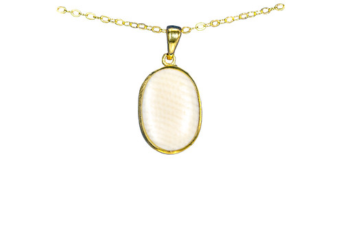 Small Oval Mammoth 14K Gold Pendant | F&F Inc.
This magnificent small oval piece is inlayed into a 14K Gold pendant.  This pendant comes with an 18" 14K Gold chain.  The dimensions of the mammoth pendant tusk is approximately .70" x .46".  The product id # is PM-1072-G.
It is a 14K plate on sterling silver. The plating is with 30mils of 14k gold. Typically plating is done with 3mils of gold. We work with the extra gold plating to ensure your beautiful jewelry piece will have a strong gold color for years to come!!
The pre-historic Mammoth tusks are found as a bi - product of the gold mining industry in Alaska. They are carbon dated to be approximately 25,800 years old.  The color of your mammoth tusk may vary due to the minerals in the ground water where the tusks are buried.  The varying color of the mammoth tusks make each piece of jewelry unique. Cracks and splits in the ivory occur naturally due to it’s great age.  Our materials are considered eco-friendly because no animals were harmed in the making of this beautiful piece of jewelry. 
All pendants come boxed with a Mammoth Ivory story card.
Enjoy your unique piece of history!
Due to State law, the sale of antique Mammoth Ivory is not allowed to be sold in the following states. California, Hawaii, Nevada, New Jersey, New York, and Oregon.  If the product is to be shipped to these states, the order will be cancelled and you will be notified!
Features
Made in the USA!! 
Antique Mammoth Tusk from Alaska
Small Oval Shaped
18" 14K Gold chain
14K Gold
Custom Artwork is available
Lifetime Guarantee!! Small Oval Mammoth 14K Gold Pendant | F&F Inc.
This magnificent small oval piece is inlayed into a 14K Gold pendant.  This pendant comes with an 18" 14K Gold chain.  The dimensions of the mammoth pendant tusk is approximately .70" x .46".  The product id # is PM-1072-G.
It is a 14K plate on sterling silver. The plating is with 30mils of 14k gold. Typically plating is done with 3mils of gold. We work with the extra gold plating to ensure your beautiful jewelry piece will have a strong gold color for years to come!!
The pre-historic Mammoth tusks are found as a bi - product of the gold mining industry in Alaska. They are carbon dated to be approximately 25,800 years old.  The color of your mammoth tusk may vary due to the minerals in the ground water where the tusks are buried.  The varying color of the mammoth tusks make each piece of jewelry unique. Cracks and splits in the ivory occur naturally due to it’s great age.  Our materials are considered eco-friendly because no animals were harmed in the making of this beautiful piece of jewelry. 
All pendants come boxed with a Mammoth Ivory story card.
Enjoy your unique piece of history!
Due to State law, the sale of antique Mammoth Ivory is not allowed to be sold in the following states. California, Hawaii, Nevada, New Jersey, New York, and Oregon.  If the product is to be shipped to these states, the order will be cancelled and you will be notified!
Features
Made in the USA!! 
Antique Mammoth Tusk from Alaska
Small Oval Shaped
18" 14K Gold chain
14K Gold
Custom Artwork is available
Lifetime Guarantee!!