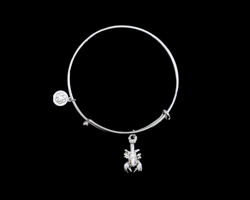 Lobster Adjustable Bracelet Display.    The beautiful adjustable bracelet is decorated with a Lobster charm.  The dimensions of the charm are .43" x .87".  The product ID is NC 07-103-S.

This bracelet is a one size for most, with an adjustable wire band.  Each bracelet can be customized with different unique charms to attach.  All parts are made in the USA!.

The silver bracelets are steel with rhodium plating.  They are e-coated to help prevent tarnishing.

The Lobster charm is a lead free casted pewter.