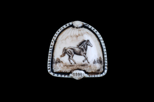 MVD PN 43 Horse Zoom.  This distinct originally hand etched Horse designed pin/pendant. The backing of this piece has the findings to be a pin, as well as a pendant.  They come with an 18" Silver Plated Chain.  This is part of the incredible line of Mossup Valley Designs that we carry, with the wonderful artist Rachel Badeau.  The dimensions of the necklace are 1.36" x 1.35" x 0.36".  The SKU is MVD PN 43.

Rachel Badeau has been etching and engraving in a variety of media for over thirty years.  Her work, characterized by fine line and intricate detail, attempts to touch the hearts and emotions of others.  All while reflecting her love of animals, nature and the human spirit.  

The resin scrimshaw piece is originally hand etched by Rachel Badeau.  We make a mold of the original piece and do an open cast pour of our resin mixture.  The pieces are removed from the mold and sanded and inked.