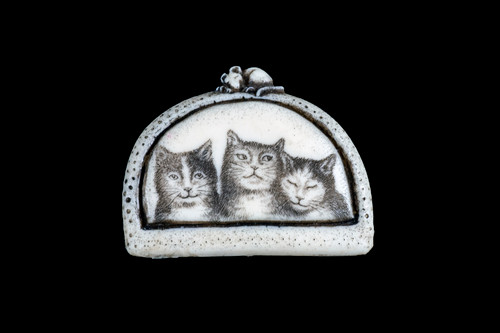 MVD PN - 12 Three Cats Zoom.  This unique originally hand etched Three Cats designed pin/pendant.    The backing of this piece has the findings to be a pin, as well as a pendant.  They come with an 18" Silver Plated Chain.  This is part of the incredible line of Mossup Valley Designs that we carry, with the wonderful artist Rachel Badeau.  The dimensions of the necklace are 1.41" x 1.85" x 0.54".  The SKU is MVD PN 12.

Rachel Badeau has been etching and engraving in a variety of media for over thirty years.  Her work, characterized by fine line and intricate detail, attempts to touch the hearts and emotions of others.  All while reflecting her love of animals, nature and the human spirit.  

The resin scrimshaw piece is originally hand etched by Rachel Badeau.  We make a mold of the original piece and do an open cast pour of our resin mixture.  The pieces are removed from the mold and sanded and inked.