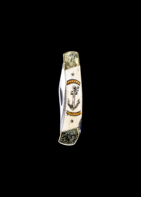 LB 416CV Colored Anchor Pocket Knife.  This beautiful hand etched Colored Scrimshaw Anchor design with colored ink rope on a 440 Stainless Steel Blade LB 5 Knife.  This beautiful knife is part of the Scrimshaw Collection, with those words laser engraved into the blade.  The LB 5 knifes come with the pictured leather sheath and each scale is made with Bovine Bone.  The LB 5 Knife has bolsters and shackle that are nickel silver with brass pins and liner.  It is a lock blade knife and a very useful pocket knife. The dimensions of the LB 5 Pocket Knife with the blade closed are 3.71" x 0.90" x 0.39".  The blade itself is approximately 2.80" making the width of the knife with an open blade 6.51".  The SKU is LB-5 416CV.

The scrimshaw is inked with black india ink and sealed with renaissance wax, which is used by museums for antique restoration.  It also helps bring out the beauty of the artwork as well as in the cow bone. The knife is water resistant, but not waterproof.