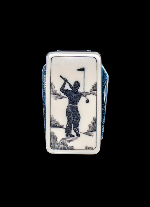 NC 20K 152 Golfer.  This beautiful originally hand etched Golfer design on a Large Rectangle Knife Money Clip.  This unique money clip has a small knife blade and a nail filer.  This is a practical money clip that duals as a practical knife.

The artwork was originally hand etched by Linda Layden.  The dimensions of the Large Rectangle Knife Money Clip with the blade(s) closed are 2.08" x 1.32" x 0.30".  The knife blade itself is approximately 1.45" and the nail file is approximately 1.50", making the width of the money clip with both open 5.03".  The SKU is NC 20K - 152.

Linda Layden has been making beautiful works of art in the scrimshaw field for over 40 years.  Originally a hobby that became a full time job.  Her work can be found in gift shops, galleries and museums across the world.