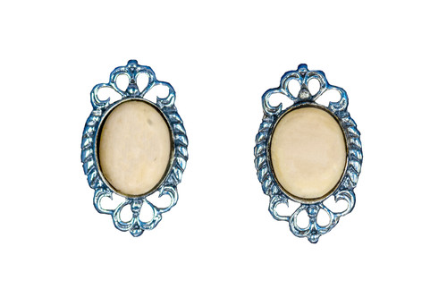 Classic Round Oval Alaskan Mammoth with Unique Sterling Silver Design Earring | F&F Inc.
This stunning classic round oval Alaskan Mammoth piece is inlayed into a elegant Sterling Silver post earring.  The measurements of the earrings are approximately .68" x .41".  The product ID is EM-1227-S.
The pre-historic Mammoth tusks are found as a bi - product of the gold mining industry in Alaska. They are carbon dated to be approximately 25,800 years old.  The color of your mammoth tusk may vary due to the minerals in the ground water where the tusks are buried.  The varying color of the mammoth tusks make each piece of jewelry unique. Cracks and splits in the ivory occur naturally due to it’s great age.  Our materials are considered eco-friendly because no animals were harmed in the making of this beautiful piece of jewelry. 
Enjoy your unique piece of history!
Due to State law, the sale of antique Mammoth Ivory is not allowed to be sold in the following states. California, Hawaii, Nevada, New Jersey, New York, and Oregon.  If the product is to be shipped to these states, the order will be cancelled and you will be notified!
Features
Antique Mammoth Tusk
Classic Round Oval Jade
Sterling Silver
French Wire
Custom Artwork is available
Lifetime Guarantee!! Classic Round Oval Alaskan Mammoth with Unique Sterling Silver Design Earring | F&F Inc.
This stunning classic round oval Alaskan Mammoth piece is inlayed into a elegant Sterling Silver post earring.  The measurements of the earrings are approximately .68" x .41".  The product ID is EM-1227-S.
The pre-historic Mammoth tusks are found as a bi - product of the gold mining industry in Alaska. They are carbon dated to be approximately 25,800 years old.  The color of your mammoth tusk may vary due to the minerals in the ground water where the tusks are buried.  The varying color of the mammoth tusks make each piece of jewelry unique. Cracks and splits in the ivory occur naturally due to it’s great age.  Our materials are considered eco-friendly because no animals were harmed in the making of this beautiful piece of jewelry. 
Enjoy your unique piece of history!
Due to State law, the sale of antique Mammoth Ivory is not allowed to be sold in the following states. California, Hawaii, Nevada, New Jersey, New York, and Oregon.  If the product is to be shipped to these states, the order will be cancelled and you will be notified!
Features
Antique Mammoth Tusk
Classic Round Oval Jade
Sterling Silver
French Wire
Custom Artwork is available
Lifetime Guarantee!!