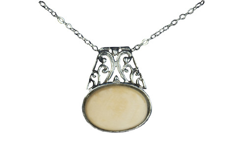 Elegant Oval Alaskan Mammoth Sterling Silver Pendant | F&F Inc.

This elegant Oval Alaskan Mammoth pendant with an elaborate sterling silver design.  The measurements of the earrings are approximately .78" x .94".  The product ID is EM-1108-S.

The pre-historic Mammoth tusks are found as a bi - product of the gold mining industry in Alaska. They are carbon dated to be approximately 25,800 years old.  The color of your mammoth tusk may vary due to the minerals in the ground water where the tusks are buried.  The varying color of the mammoth tusks make each piece of jewelry unique. Cracks and splits in the ivory occur naturally due to it’s great age.  Our materials are considered eco-friendly because no animals were harmed in the making of this beautiful piece of jewelry. 

All pendants come boxed with a Mammoth Ivory story card.

Enjoy your unique piece of history!

Due to State law, the sale of antique Mammoth Ivory is not allowed to be sold in the following states. California, Hawaii, Nevada, New Jersey, New York, and Oregon.  If the product is to be shipped to these states, the order will be cancelled and you will be notified!

Features:

Alaskan Mammoth
Elegant Oval Design
Sterling Silver
Lifetime Guarantee!!