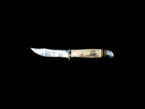 This stunning etched ship and whale design is done on Shed Moose Antler handle with a Scrimshaw Collection straight blade..  This Bowie like knife, comes with the pictured leather sheath.

The weight of the knife is 5 ounces and the dimensions of the SBA 406 Knife is 7.6" x .92" x 0.88".  The blade itself is approximately 3.5".  The SKU is SBA 406. 

The artwork was originally hand etched by Bill Feeney. He received a Bachelor of Arts degree in Mathematics from Saint Francis College in Bidderford, Maine, In 1973 I accepted a teaching position at Westport High School where I met Robert Rayno, the art teacher. As part of the class curriculum, he taught a section on scrimshaw. I sat in on many of his classes and purchased the necessary tools and ivory to begin etching. Combining my natural artistic ability with the techniques learned from Mr. Rayno, the cornerstone of "Spouting Whale" was established.

During the winter season, moose shed their antlers before regrowing them in the spring. The shedding process, also known as casting, is a normal event that occurs annually for many male cervids—a group of hoofed mammals like moose, deer and elk.




Features:
Scrimshaw
Nautical Design
Ship and Whale

Shed Antler Handle
Leather Sheath
Straight Blade Knife

Bowie Style Knife

Stainless Steel Blade