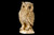 This is a beautiful hand carved eco-ivory Owl Statue.  The dimensions of the Owl are .90" x 1.82" x .79".  The SKU is C-17.

This unique Sitting Bear statue will make a great addition to any room in the house.  You can place it on any flat surface to diplay, or a great gift for children to have.

All statues are hand carved in clay.  We then make a mold of the original piece before producing them into the final acrylic resin product with an antique finish.