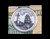 Ship and Light Money Clip with Money.This stunning originally hand etched Scrimshaw Ship and Lighthouse design on a Rond Spring Money Clip.  This unique piece is a spring money clip.  The back of the money clip has a stainless steel spring that will hold your money secure.  Regardless if it is a small or large stack of bills.  

The artwork was originally hand etched by Linda Layden.  The artistic insert is an 1.5", the size of a silver dollar.  The dimensions of the Large Rectangle Money Clip is 1.68" x 1.81" x 0.46".  The SKU is NC 24 - 406.