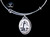 NC 07-820-S EtchedAdjustable Bracelets Neds Point Lighthouse Vertical Zoom.  The beautiful adjustable bracelet is decorated with a Vertical originally Hand etched Lighthouse Charm.  The product ID is NC 07-820-SE.  The design of the Lighthouse, is that of Ned's Point which is located in Mattapoisett, MA.  

This bracelet is a one size for most, with an adjustable wire band.  Each bracelet can be customized with different unique charms to attach.  All parts are made in the USA!.

The Eco-Ivory Scrimshaw Charm is 13x18.  The artwork was originally hand etched by Linda Layden.

Linda Layden has been making beautiful works of art in the scrimshaw field for over 40 years.  Originally a hobby that became a full time job.  Her work can be found in gift shops, galleries and museums across the world.  

We make a mold of the original piece and do an open cast pour of our resin mixture.  The pieces are removed from the mold and sanded and inked.