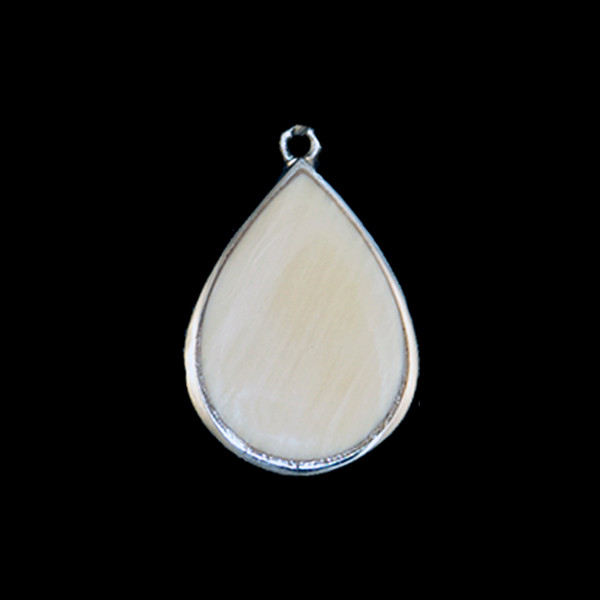 This charming teardrop oval shaped mammoth tusk piece is inlayed into a sterling silver pendant.  This pendant comes with an 18" Sterling Silver chain.  The dimensions of the mammoth pendant tusk is approximately .82" x .50".