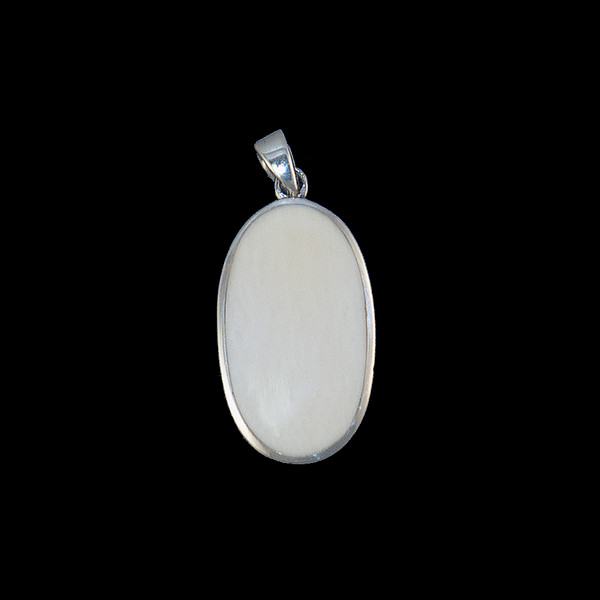 This impressive medium oval piece is inlayed into a sterling silver pendant.  This pendant comes with an 18" Sterling Silver chain.  The dimensions of the mammoth pendant tusk is approximately .98" x .53".