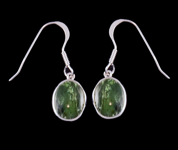 This trendy Oval Shaped Alaskan Jade piece is inlayed into a Sterling Silver french wire earring.  The measurements of the earrings are approximately .375 x .380".