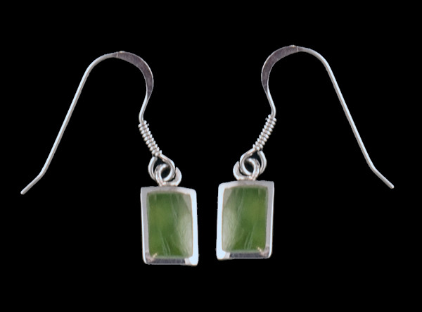 This sharp small rectangle shaped Alaskan Jade piece is inlayed into a Sterling Silver french wire earring.  The measurements of the earrings are approximately .26 x .42".