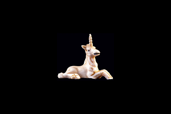 This is a beautiful hand carved eco-ivory Unicorn Statue. The dimensions of the Unicorn Statue are 1.41" x 1.35" x 1.08".  The SKU is C-58.

This decorative Unicorn Statue will make a great addition to any room in the house.  You can place it on any flat surface to display, or a great gift for children to have.

All statues are hand carved in clay.  We then make a mold of the original piece before producing them into the final acrylic resin product with an antique finish.