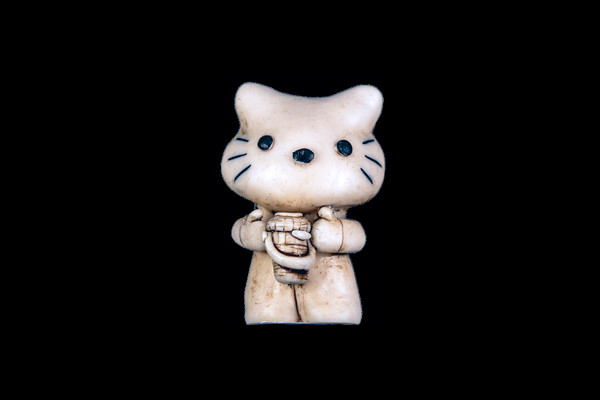 This is a stunning hand carved eco-ivory Cat Statue.  The dimensions of the Cat Statue are 1.41" x 2.47" x 1.51".  This beatuiful design has a carved Cat holding a Nantucket Basket.  The SKU is C-65.  

This unique Double Cat Statue will make a great addition to any room in the house.  You can place it on any flat surface to display, or a great gift for children to have.

This piece was originally hand carved by Sheryl Tray, an artist located in Hawaii.  The artwork you see here is a memory, captured in clay by Sheryl in her many travels.  The clay original, sculpted in her small studio in Honolulu, is sent to a sent to us to be cast in either metal or resin and presented here for you to enjoy.  Please take a piece home for yourself, or as a present for a special friend who loves and values the great outdoors as much as Sheryl.
