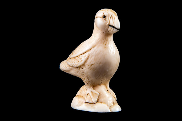 This is a beautiful hand carved eco-ivory Puffin Statue.  The dimensions of the Puffin Statue are 0.86" x 1.88" x 1.80".  The SKU is C-56.  

This stunning Puffin Statue will make a great addition to any room in the house.  You can place it on any flat surface to display, or a great gift for children to have.

All statues are hand carved in clay.  We then make a mold of the original piece before producing them into the final acrylic resin product with an antique finish.