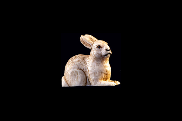 This is a cute hand carved eco-ivory Rabbit Statue.  The dimensions of the Rabbit Statue are 1.05" x 1.66" x 1.41".  The SKU is C-29.  

This elaborate Rabbit Statue will make a great addition to any room in the house.  You can place it on any flat surface to display, or a great gift for children to have.

All statues are hand carved in clay.  We then make a mold of the original piece before producing them into the final acrylic resin product with an antique finish.