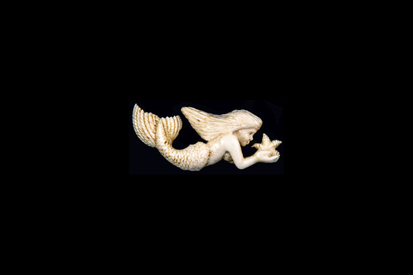 This is a exquisite hand carved eco-ivory Flat Back Mermaid Statue.  The dimensions of the Flat Back Mermaid Statue are 2.42" x 1.02" x .35".  The SKU is C-54.  

This detailed Flat Back Mermaid will make a great addition to any room in the house.  You can place it on any flat surface to display, or a great gift for children to have.

All statues are hand carved in clay.  We then make a mold of the original piece before producing them into the final acrylic resin product with an antique finish.