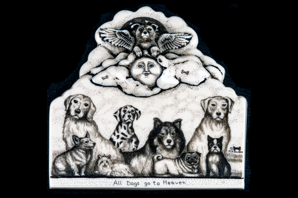 This is a gorgeous wall plaque was originally hand etched Small All Dogs go to Heaven Wall Plaque design.  This is part of the incredible line of Mossup Valley Designs that we carry, with the wonderful artist Rachel Badeau.  The dimensions of the plaque are 4.26" x 4.10" x 0.61".  The SKU is MVD WP 6.

Rachel Badeau has been etching and engraving in a variety of media for over thirty years.  Her work, characterized by fine line and intricate detail, attempts to touch the hearts and emotions of others.  All while reflecting her love of animals, nature and the human spirit.  

The resin scrimshaw piece is originally hand etched by Rachel Badeau.  We make a mold of the original piece and do an open cast pour of our resin mixture.  The pieces are removed from the mold and sanded and inked.