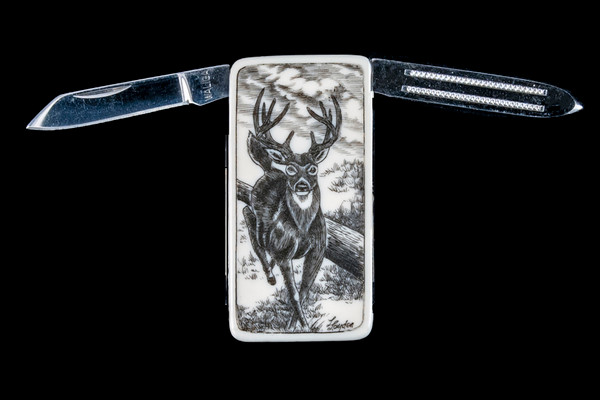 Deer NC 20 Open.  This beautiful originally hand etched Deer design on a Large Rectangle Knife Money Clip.  This unique money clip has a small knife blade and a nail filer.  This is a practical money clip that duals as a practical knife.

The artwork was originally hand etched by Linda Layden.  The dimensions of the Large Rectangle Knife Money Clip with the blade(s) closed are 2.08" x 1.32" x 0.30".  The knife blade itself is approximately 1.45" and the nail file is approximately 1.50", making the width of the money clip with both open 5.03".  The SKU is NC 20 - 103A.