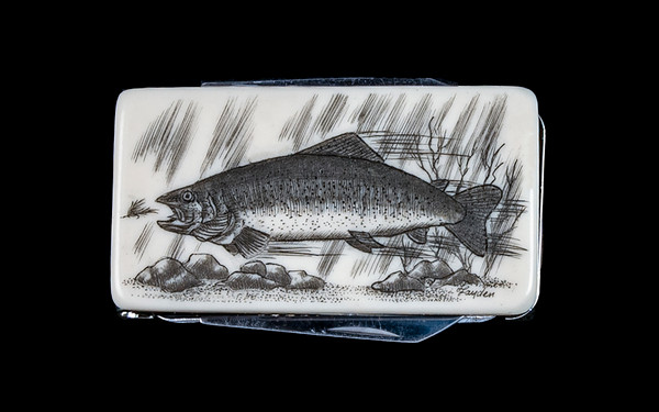 Trout NC 20 Money Clip Knife.  This beautiful originally hand etched Trout design on a Large Rectangle Knife Money Clip.  This unique money clip has a small knife blade and a nail filer.  This is a practical money clip that duals as a practical knife.

The artwork was originally hand etched by Linda Layden.  The dimensions of the Large Rectangle Knife Money Clip with the blade(s) closed are 2.08" x 1.32" x 0.30".  The knife blade itself is approximately 1.45" and the nail file is approximately 1.50", making the width of the money clip with both open 5.03".  The SKU is NC 20 - 109.
