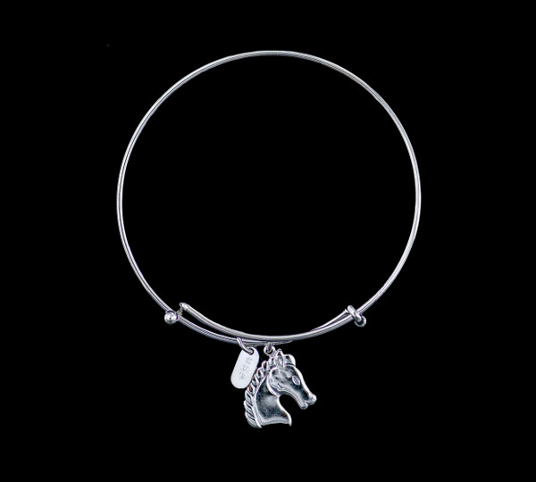 The beautiful adjustable bracelet is decorated with a Horse charm.  The product ID is NC 07-134-S.

This bracelet is a one size for most, with an adjustable wire band.  Each bracelet can be customized with different unique charms to attach.  All parts are made in the USA!.

The silver bracelets are steel with rhodium plating.  They are e-coated to help prevent tarnishing.

The Horse charm is a lead free casted pewter.