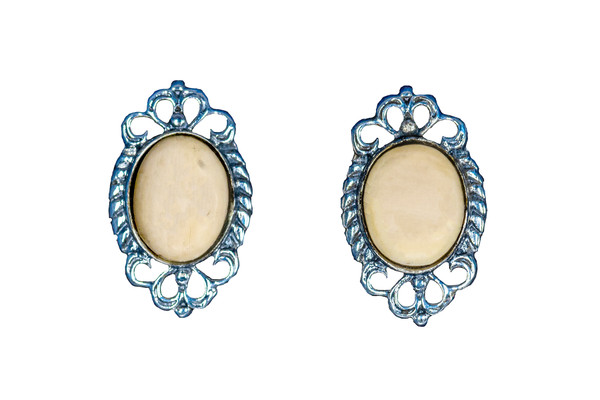 Classic Round Oval Alaskan Mammoth with Unique Sterling Silver Design Earring | F&F Inc.
This stunning classic round oval Alaskan Mammoth piece is inlayed into a elegant Sterling Silver post earring.  The measurements of the earrings are approximately .68" x .41".  The product ID is EM-1227-S.
The pre-historic Mammoth tusks are found as a bi - product of the gold mining industry in Alaska. They are carbon dated to be approximately 25,800 years old.  The color of your mammoth tusk may vary due to the minerals in the ground water where the tusks are buried.  The varying color of the mammoth tusks make each piece of jewelry unique. Cracks and splits in the ivory occur naturally due to it’s great age.  Our materials are considered eco-friendly because no animals were harmed in the making of this beautiful piece of jewelry. 
Enjoy your unique piece of history!
Due to State law, the sale of antique Mammoth Ivory is not allowed to be sold in the following states. California, Hawaii, Nevada, New Jersey, New York, and Oregon.  If the product is to be shipped to these states, the order will be cancelled and you will be notified!
Features
Antique Mammoth Tusk
Classic Round Oval Jade
Sterling Silver
French Wire
Custom Artwork is available
Lifetime Guarantee!! Classic Round Oval Alaskan Mammoth with Unique Sterling Silver Design Earring | F&F Inc.
This stunning classic round oval Alaskan Mammoth piece is inlayed into a elegant Sterling Silver post earring.  The measurements of the earrings are approximately .68" x .41".  The product ID is EM-1227-S.
The pre-historic Mammoth tusks are found as a bi - product of the gold mining industry in Alaska. They are carbon dated to be approximately 25,800 years old.  The color of your mammoth tusk may vary due to the minerals in the ground water where the tusks are buried.  The varying color of the mammoth tusks make each piece of jewelry unique. Cracks and splits in the ivory occur naturally due to it’s great age.  Our materials are considered eco-friendly because no animals were harmed in the making of this beautiful piece of jewelry. 
Enjoy your unique piece of history!
Due to State law, the sale of antique Mammoth Ivory is not allowed to be sold in the following states. California, Hawaii, Nevada, New Jersey, New York, and Oregon.  If the product is to be shipped to these states, the order will be cancelled and you will be notified!
Features
Antique Mammoth Tusk
Classic Round Oval Jade
Sterling Silver
French Wire
Custom Artwork is available
Lifetime Guarantee!!