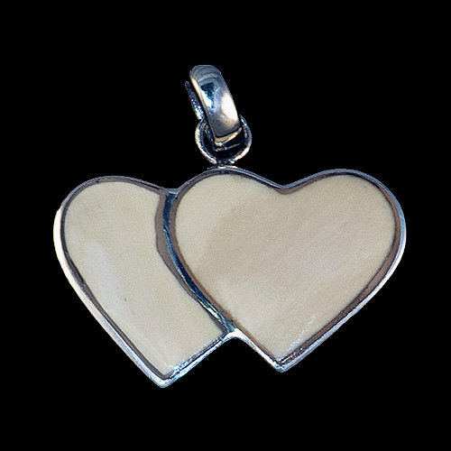 This beautiful large double heart shaped mammoth ivory tusk is inlayed into a sterling silver pendant.  This pendant comes with an 18" Sterling Silver chain.  The dimensions of the mammoth pendant tusk is approximately .92" x 1.61".