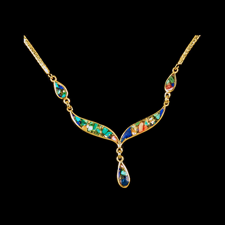 Whale Tail with Teardrop River Bed 14K Gold Pendant 

This unique whale tail with Teardrop River Bed shaped whale tail is inlayed into a 14K Gold pendant.  This pendant comes with an 18" 14K Gold chain.  The dimensions of the River Bed pendant is approximately 2.25" x 1.7".  The product id # is PRB-1008-G.

Our River Bed Jewelry is a product made in our studio, by combing Lapis, Turquoise, Spiney Oyster and either Gold or Silver Foil.  We mix the four stones and make a block that weighs 15-20lbs.  The block is then cut into stones that fit our settings. 

The earring is a 14K plate on sterling silver. The plating is done with 30mils of 14k gold. Typically plating is done with 3mils of gold. We work with the extra gold plating to ensure your beautiful jewelry piece will have a strong gold color for years to come!!

Due to the process of making the River Bed stones, no two pieces will look the same.  Your Northern Lights Jewlry will be unique and one of a kind!

All River Bed earrings come on a River Bed Jewelry Card.

Enjoy your one of a kind piece of Jewelry!