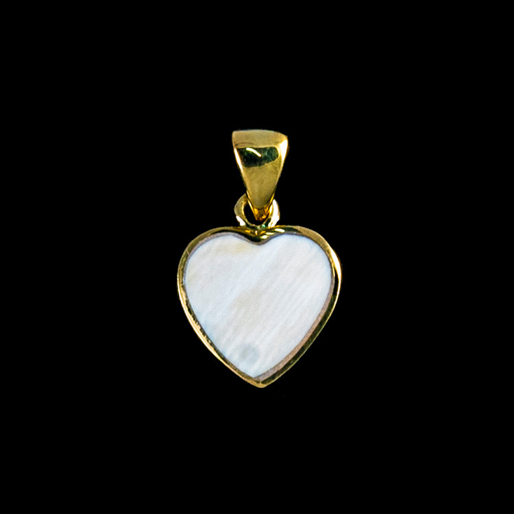 This unique heart shaped mammoth ivory tusk is inlayed into a 14K Gold pendant.  This pendant comes with an 18" 14K Gold chain.  The dimensions of the mammoth pendant tusk is approximately .58" x .50".