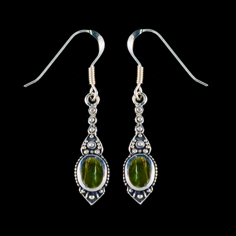 This chic small oval Alaskan Jade is inlayed into a stylish dangle Sterling Silver earring with french wire.  The measurements of the earrings are approximately .96" x .29".