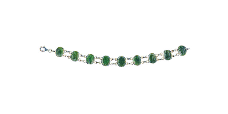 Oval Shaped Alaskan Jade with Two Links Sterling Silver Bracelet | F&F Inc.

This trendy round Alaskan Jade is inlayed into a elegant oval shaped sterling silver bracelet.  This bracelet has two sterling silver links in between the oval Alaskan Jade pieces.  The dimension of the bracelet is approximately 7.2" x .49".  The product id # is BRJ-1017-S.               

Genuine Jade (nephrite) is a fascinating gemstone and the state gem of Alaska. In prehistoric times, prized for its toughness, jade was used to make weapons, tools and later simple ornaments. Jade purportedly can protect you from evil, attract love and of course bring you good luck. It is now regarded as a symbol of energy and beauty. Stimulating creativity and mental agility along with harmony and balance. The jade we use comes from the Nana Region of Alaska.

Enjoy your unique piece of history!

Features
Made in the USA!! 
Alaskan Jade
Sterling Silver Bracelet
Oval Shaped with 2 links
Lifetime Guarantee!!