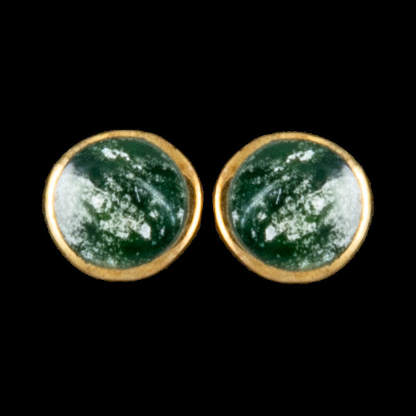 This trendy round Alaskan Jade is inlaid into a beautiful 14K Gold earring.  These unique earrings have a post backing.  The diameter of the round mammoth tusk is approximately .29".