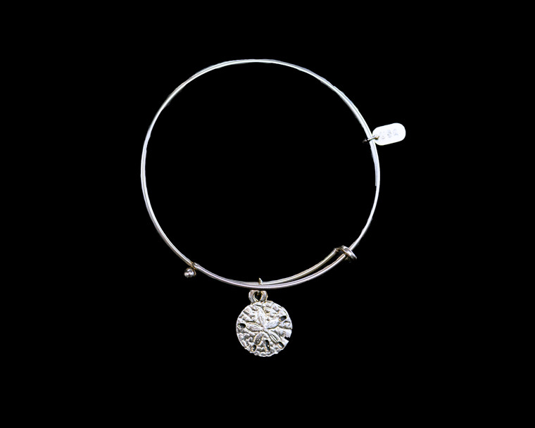 The beautiful adjustable bracelet is decorated with a Sand Dollar charm.  The dimensions of the charm are .59" x .59".  The product ID is NC 07-105-S.

This bracelet is a one size for most, with an adjustable wire band.  Each bracelet can be customized with different unique charms to attach.  All parts are made in the USA!.

The silver bracelets are steel with rhodium plating.  They are e-coated to help prevent tarnishing.

The Sand Dollar charm is a lead free casted pewter.