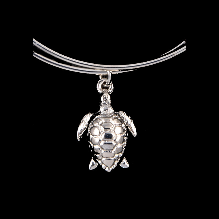 Turtle Charm Zoom.  The beautiful adjustable bracelet is decorated with a Turtle charm.  The dimensions of the charm are .54" x .74".  The product ID is NC 07-107-S.

This bracelet is a one size for most, with an adjustable wire band.  Each bracelet can be customized with different unique charms to attach.  All parts are made in the USA!.

The silver bracelets are steel with rhodium plating.  They are e-coated to help prevent tarnishing.